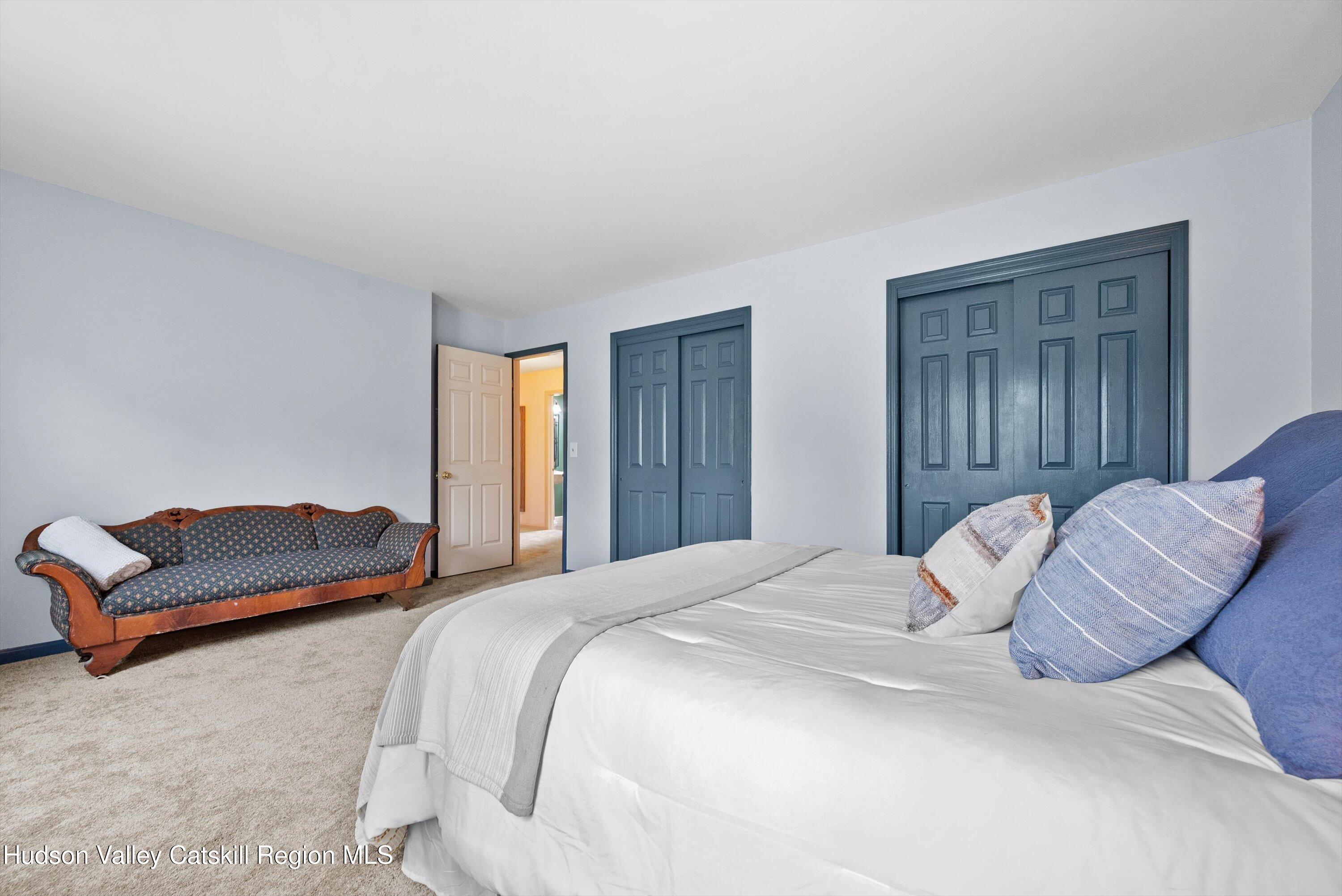 141 East Ridge Road Warwick, NY 10990 - Photo 38 of 57 a bedroom with a bed and a couch