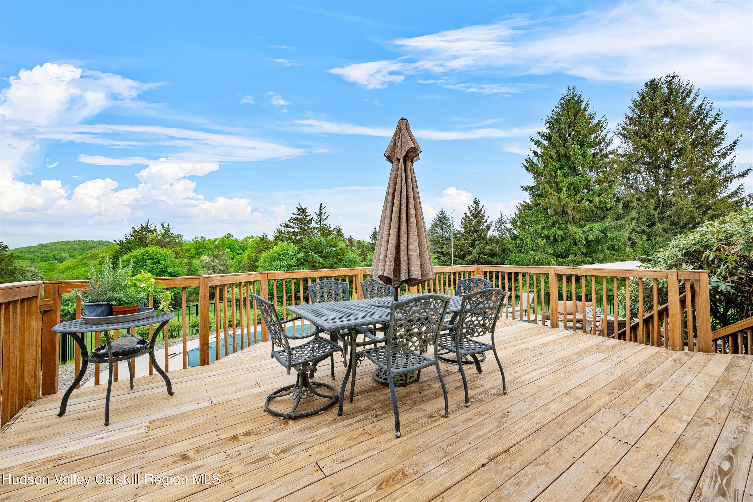 141 East Ridge Road Warwick, NY 10990 - Photo 42 of 57 a view of a deck with furniture and garden