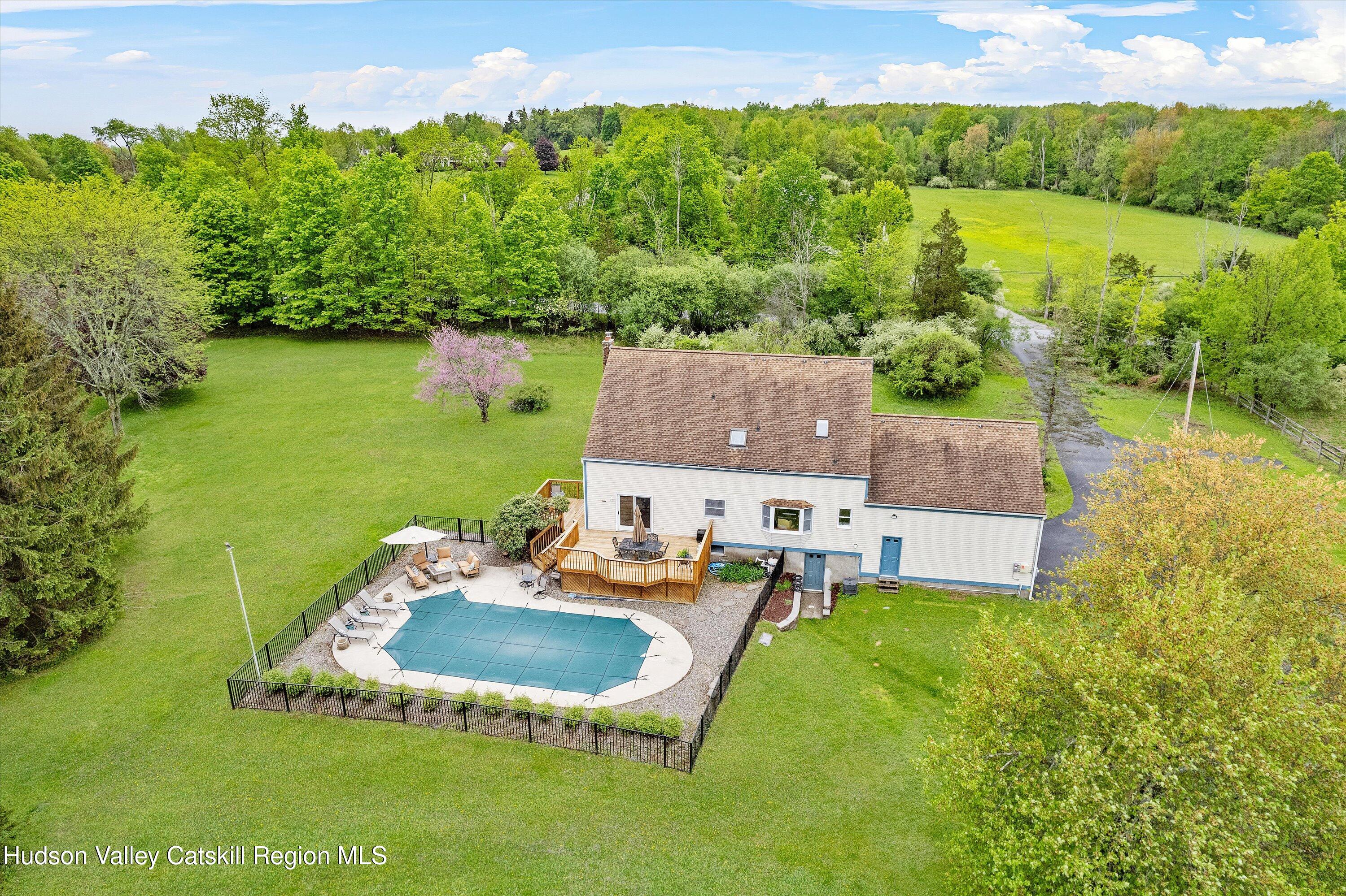 141 East Ridge Road Warwick, NY 10990 - Photo 55 of 57 a backyard of a house with table and chairs