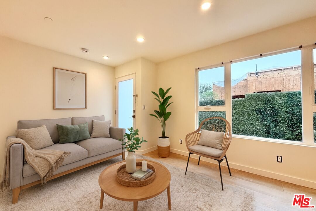 3245 Drew Street Los Angeles, CA 90065 - Photo 7 of 7 a living room with furniture and a large window