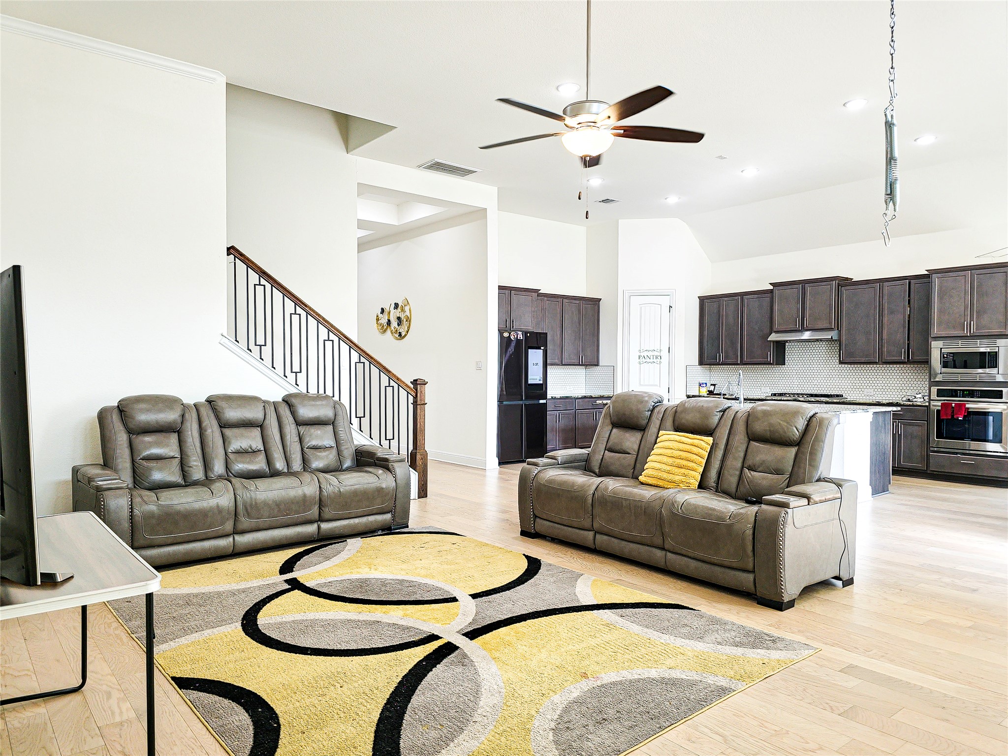 813 Sunny Ridge Drive Leander, TX 78641 - Photo 14 of 32 An open-concept living space integrates a well-appointed kitchen and living room for effortless entertaining.