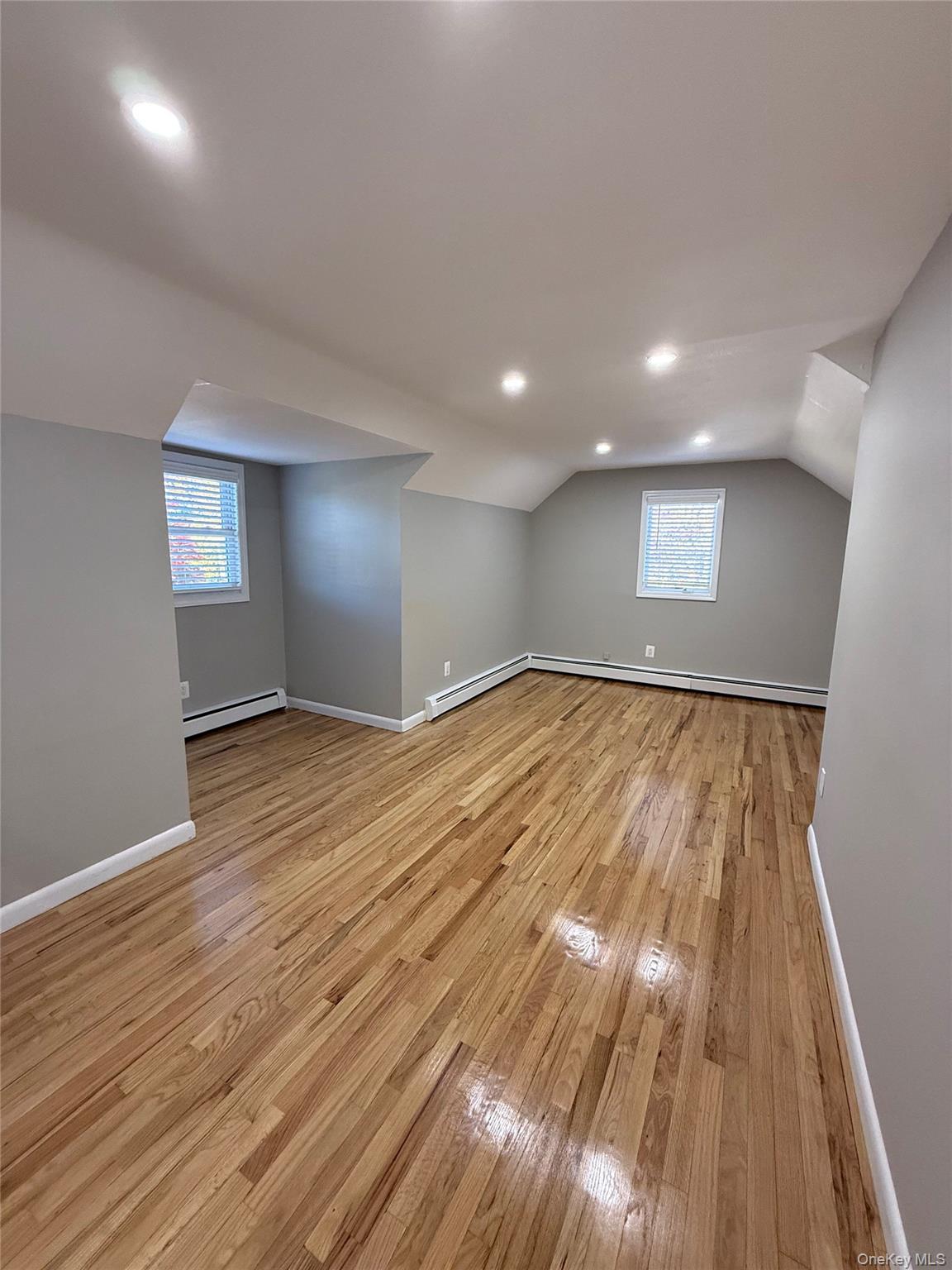 44 Pine Street Blue Point, NY 11715 - Photo 11 of 17 a view of an empty room and wooden floor