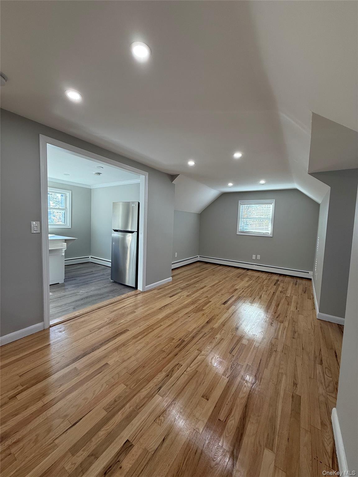 44 Pine Street Blue Point, NY 11715 - Photo 10 of 17 a view of empty room with wooden floor