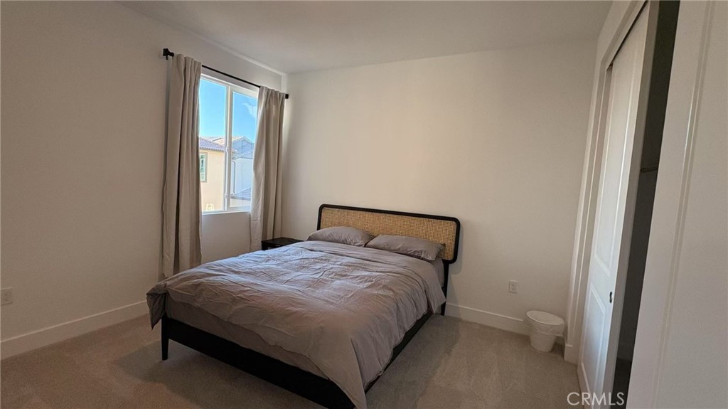 313 Terrapin Irvine, CA 92618 - Photo 11 of 14 a bedroom with a bed and a window