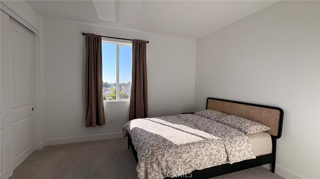 313 Terrapin Irvine, CA 92618 - Photo 12 of 14 a bedroom with a bed and window