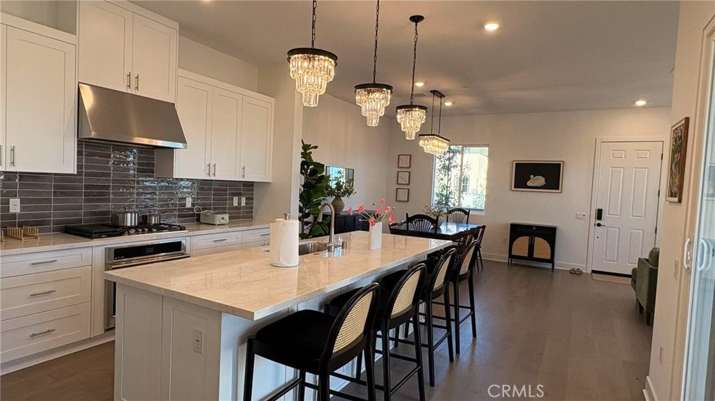 313 Terrapin Irvine, CA 92618 - Photo 7 of 14 a view of a dining room with furniture and wooden floor