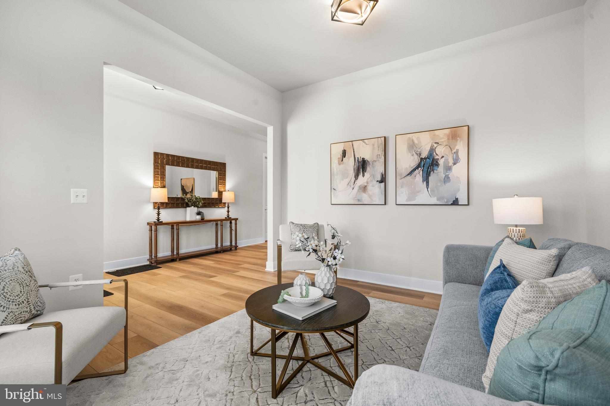 7505 Magarity Road Falls Church, VA 22043 - Photo 21 of 69 a living room with furniture and a dining table