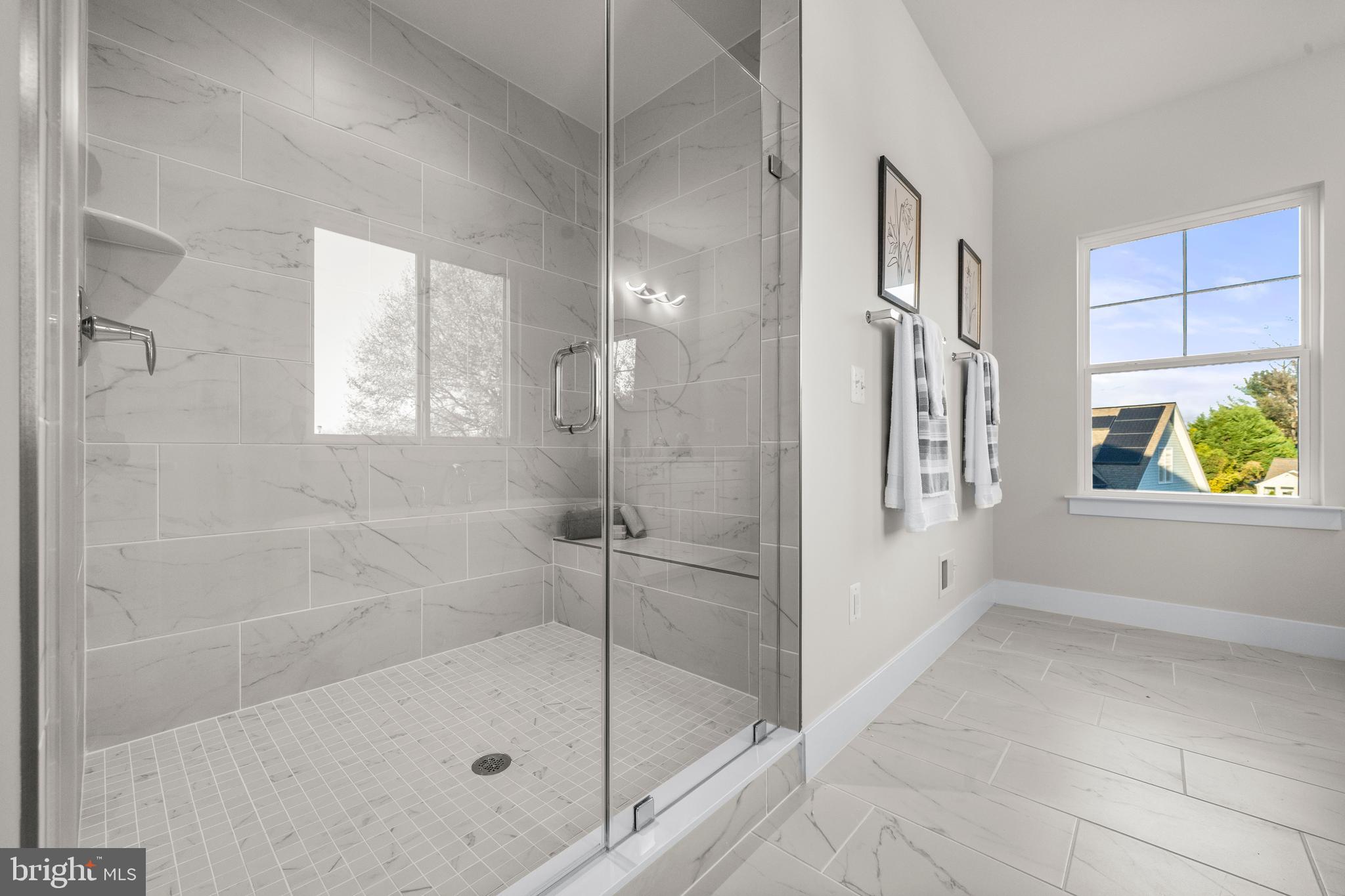 7505 Magarity Road Falls Church, VA 22043 - Photo 33 of 69 a bathroom with a bathtub and shower