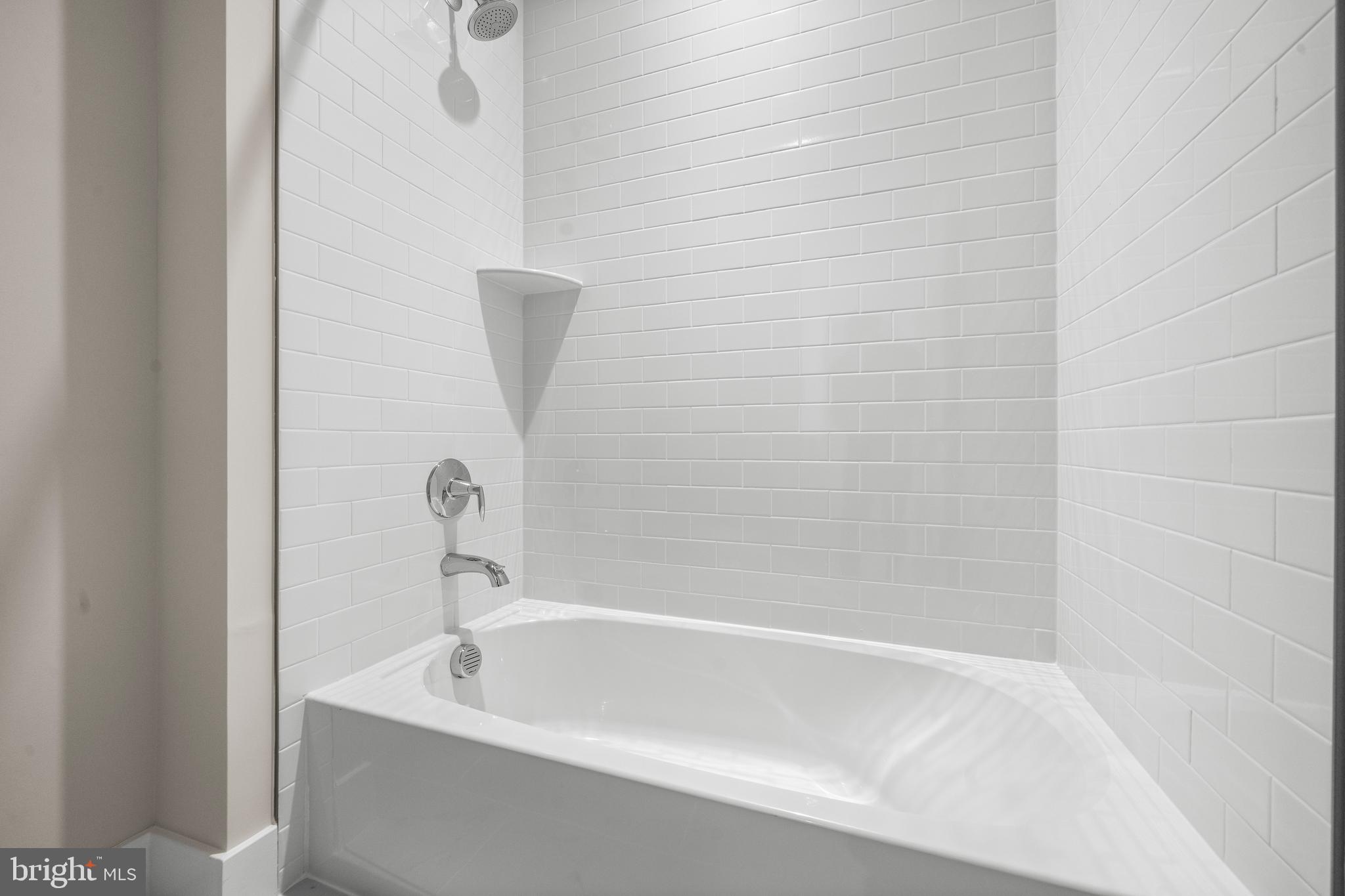 7505 Magarity Road Falls Church, VA 22043 - Photo 48 of 69 a white bath tub sitting next to a white sink