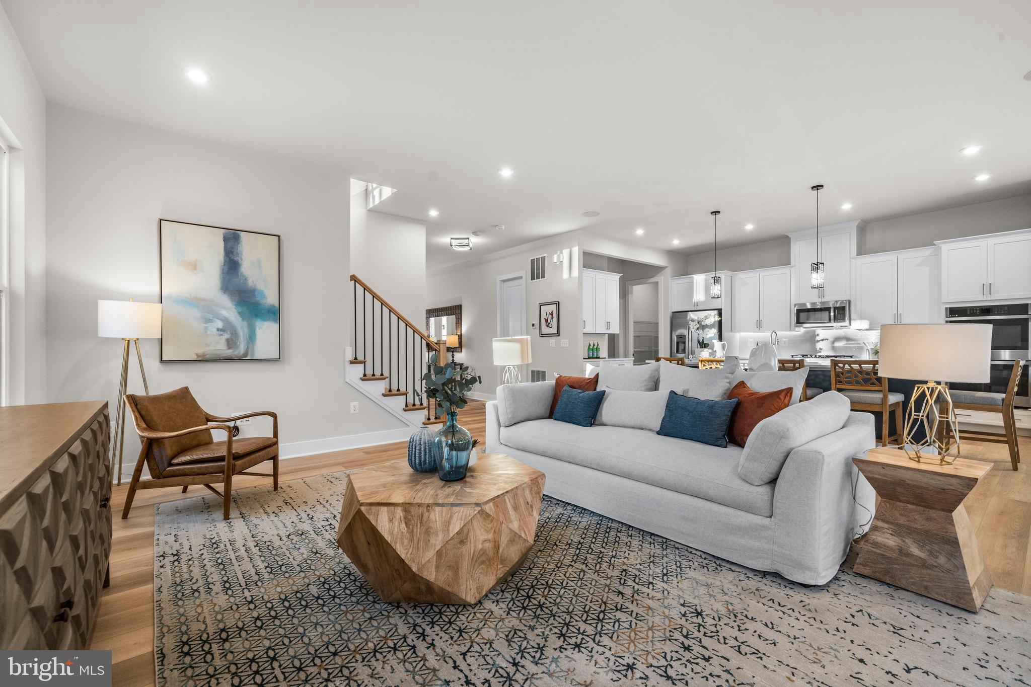 7505 Magarity Road Falls Church, VA 22043 - Photo 7 of 69 a living room with furniture kitchen view and a table