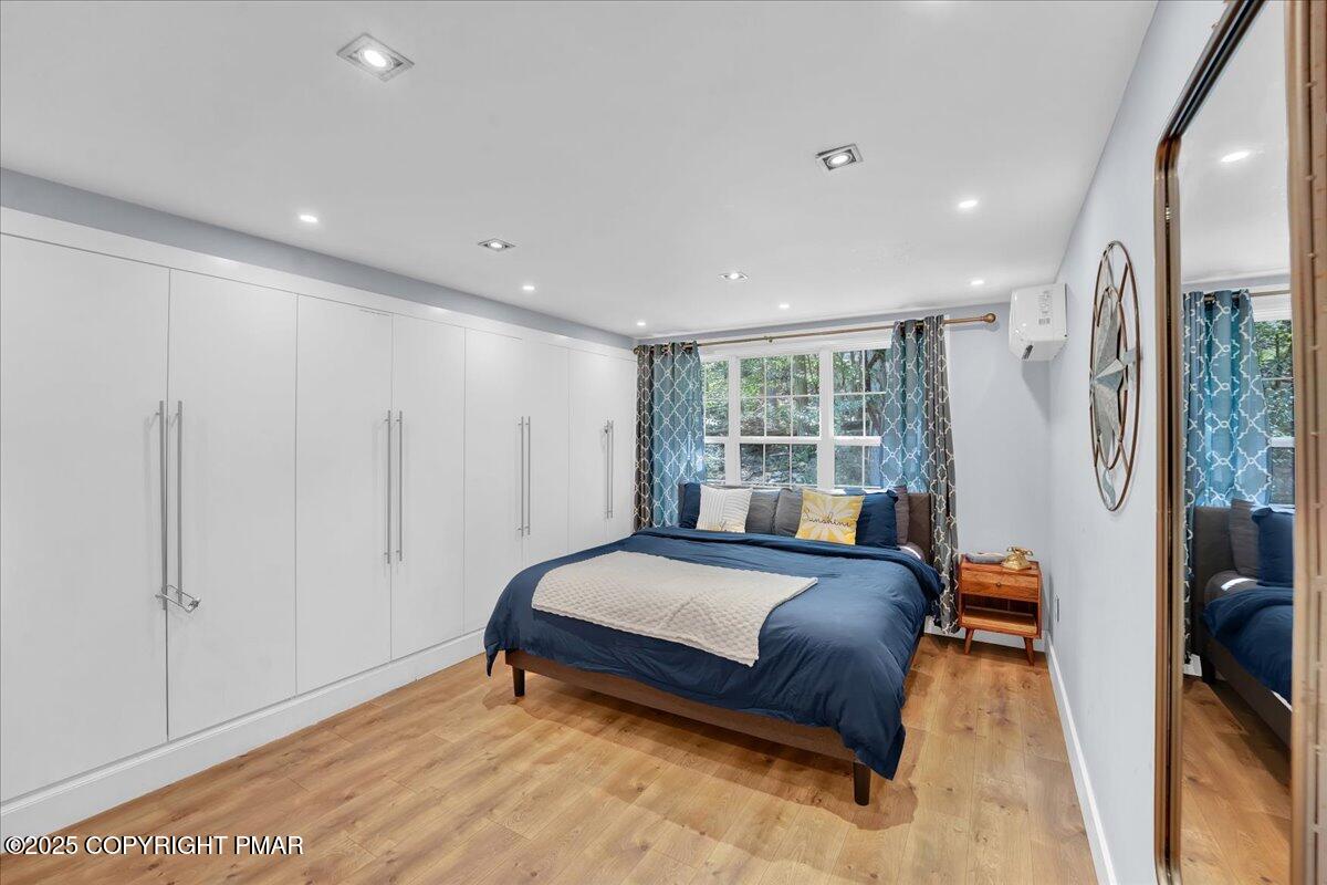 3118 Cherry Ridge Road Bushkill, PA 18324 - Photo 12 of 51 a bedroom with a bed and a window