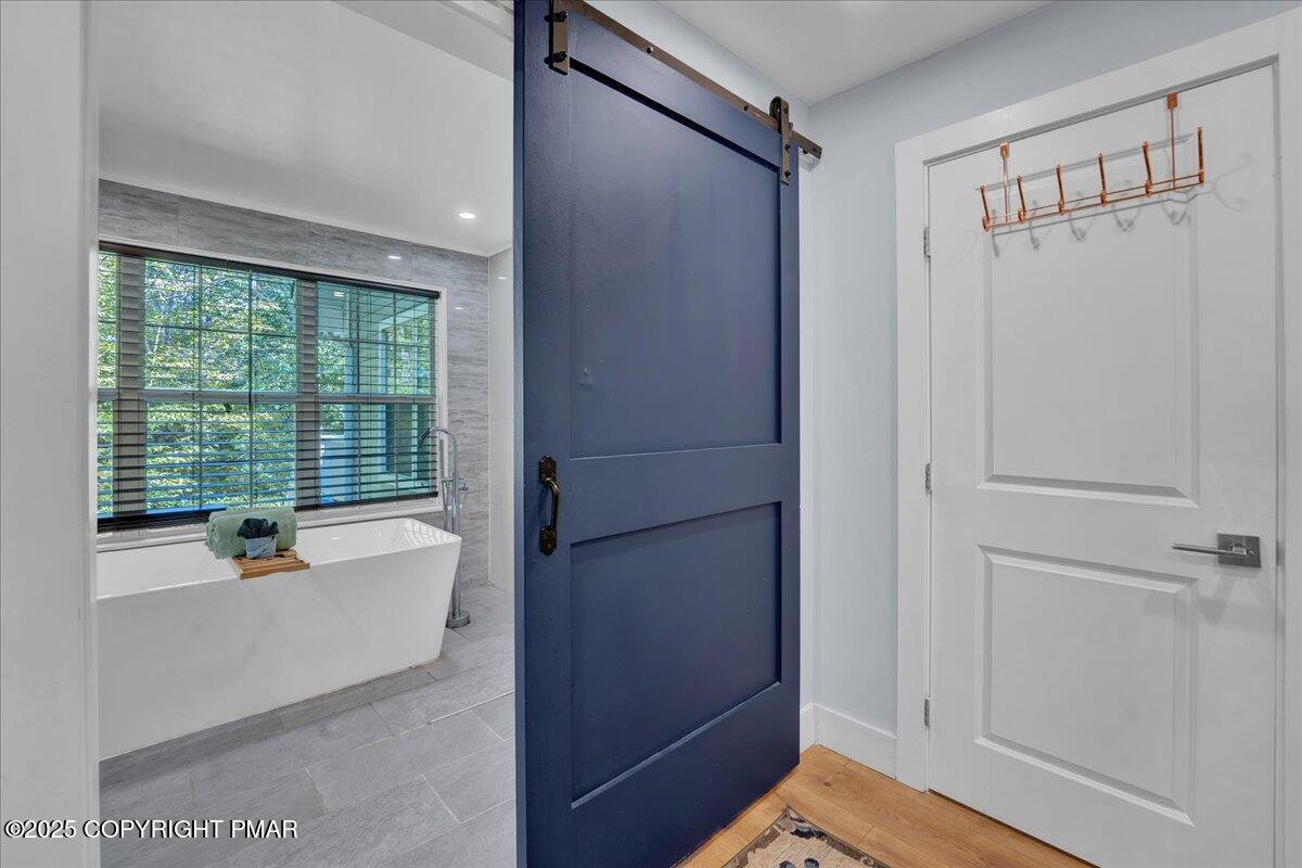 3118 Cherry Ridge Road Bushkill, PA 18324 - Photo 14 of 51 a bathroom with a tub and shower