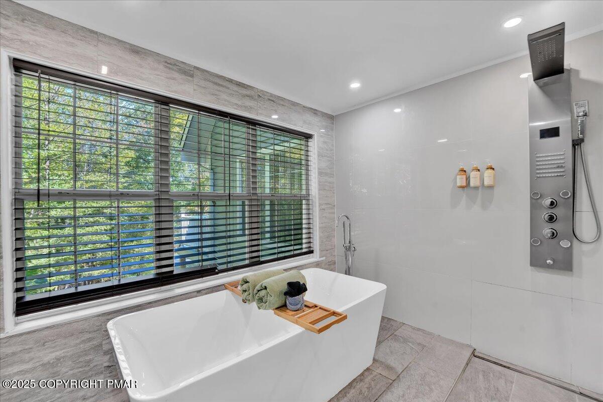 3118 Cherry Ridge Road Bushkill, PA 18324 - Photo 15 of 51 a bathroom with a tub and shower