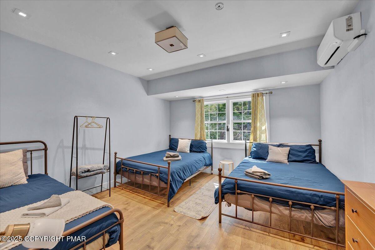 3118 Cherry Ridge Road Bushkill, PA 18324 - Photo 17 of 51 a living room with two bed and a window
