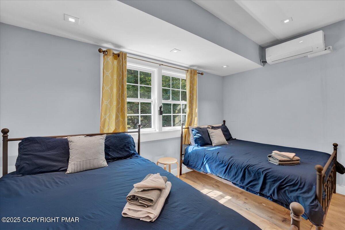 3118 Cherry Ridge Road Bushkill, PA 18324 - Photo 20 of 51 a large bedroom with a bed and a couch