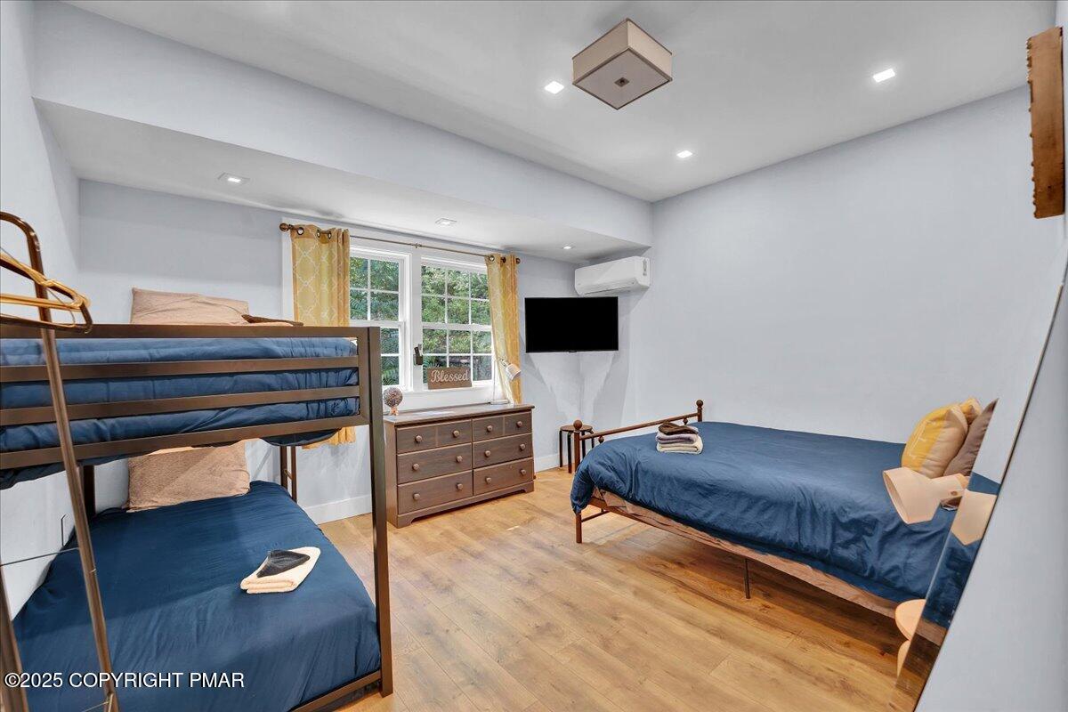 3118 Cherry Ridge Road Bushkill, PA 18324 - Photo 22 of 51 a living room with furniture and a flat screen tv