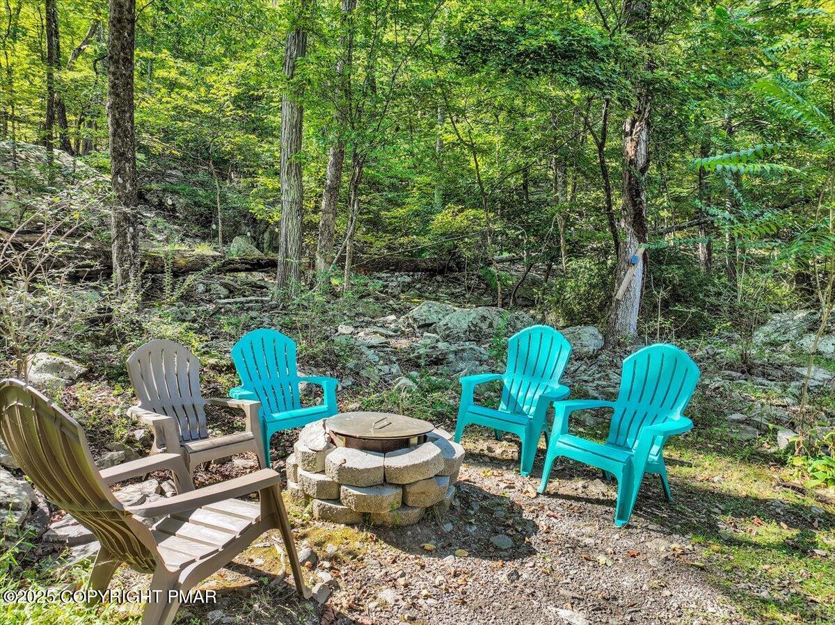 3118 Cherry Ridge Road Bushkill, PA 18324 - Photo 34 of 51 a view of a chairs and table in the backyard