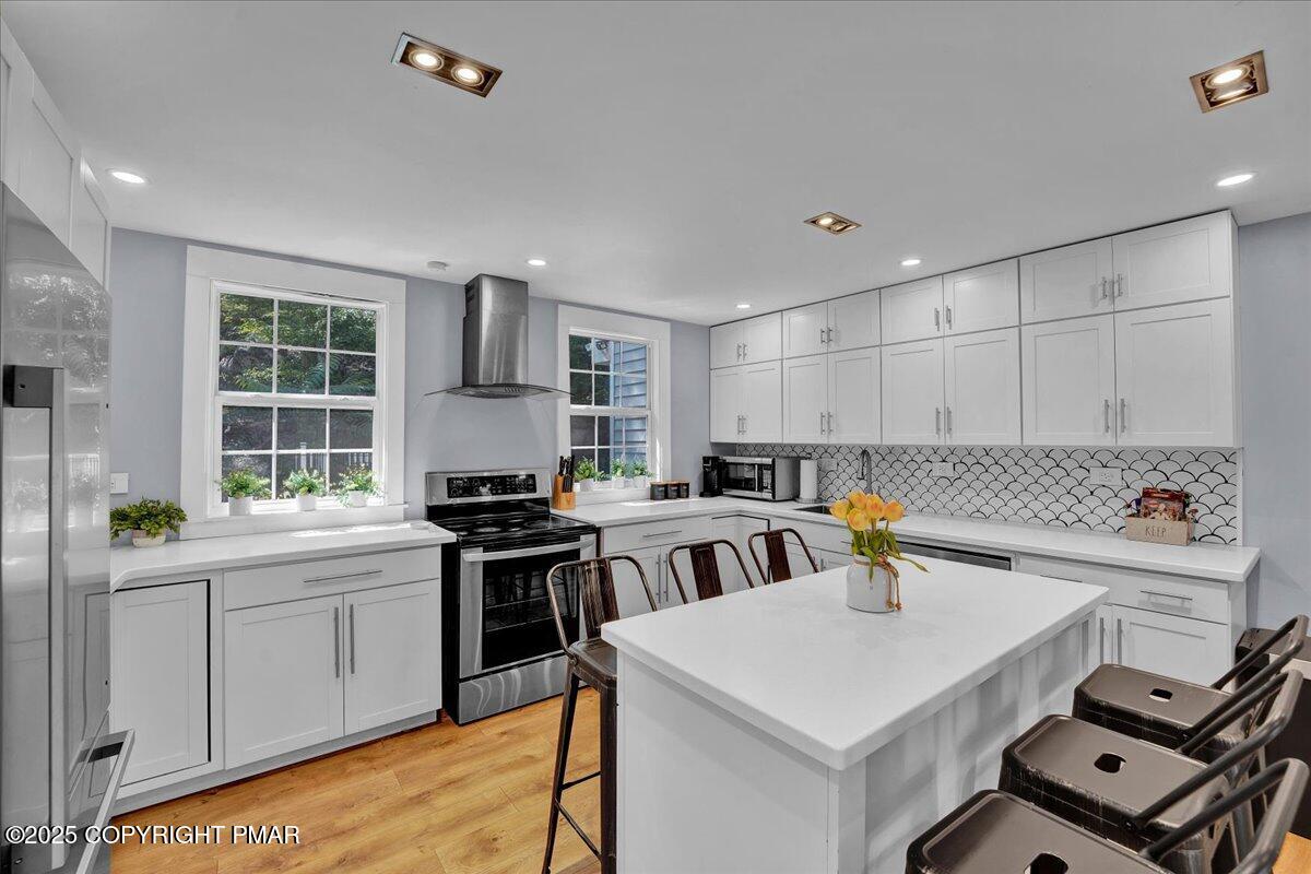 3118 Cherry Ridge Road Bushkill, PA 18324 - Photo 5 of 51 a kitchen with a stove and a sink