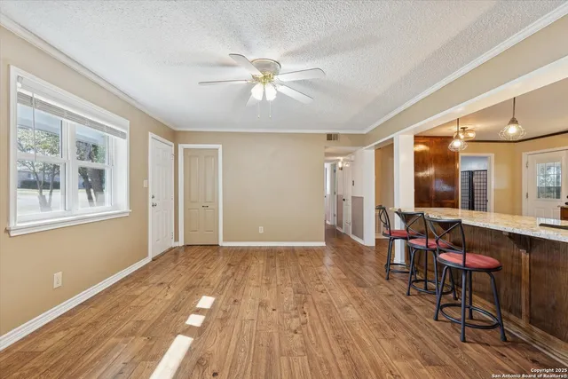 a view of livingroom with furniture window and wooden floor