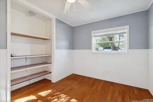 a view of an empty room with a window