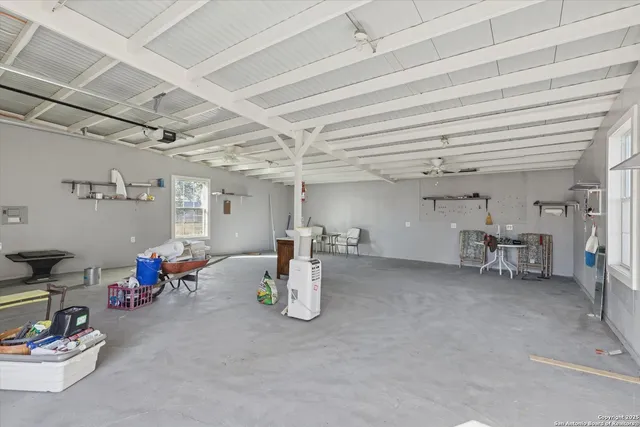 a view of a room with lots of wooden furniture