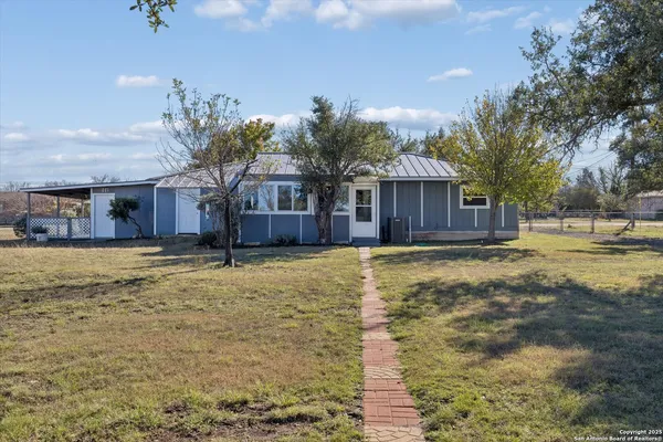 a swimming pool with outdoor seating