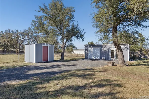 a view of street with large trees