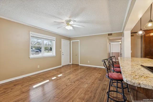 a view of a livingroom with furniture and wooden floor