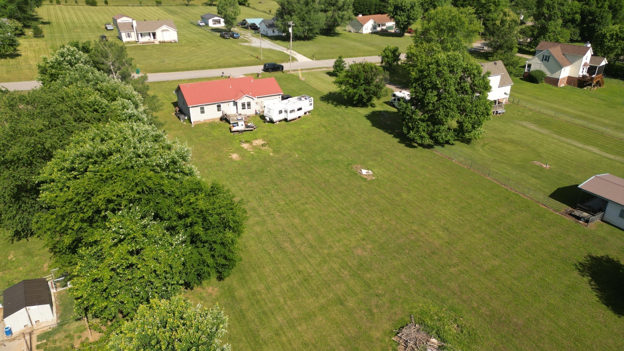 4009 Sawmill Road Woodlawn, TN 37191 - Photo 6 of 6 an aerial view of a house with an outdoor space and seating