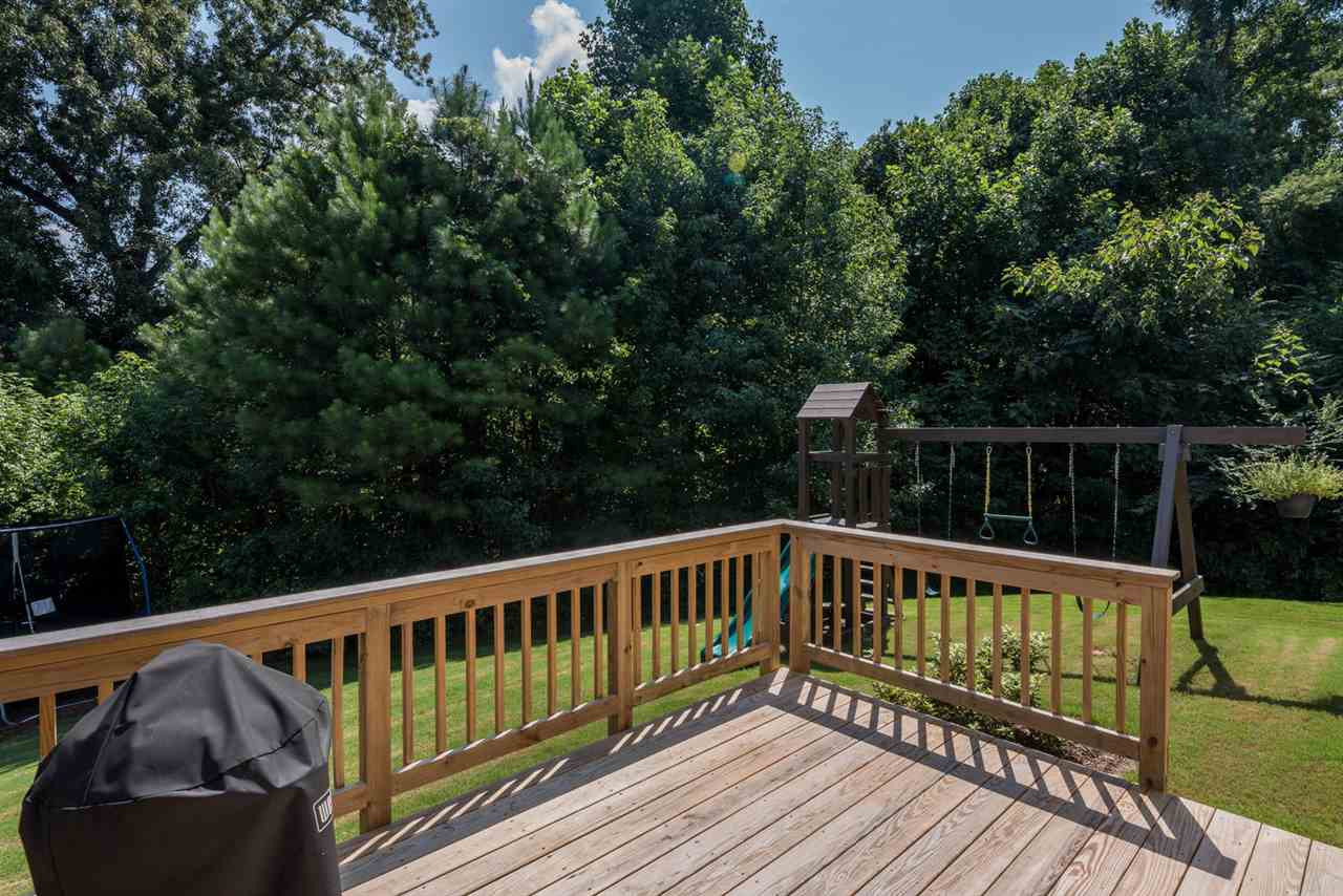 107 Holyoke Court Raleigh, NC 27603 - Photo 17 of 25 Spend time on the privacy of your back deck looking at the beautiful trees. Backyard/Deck
