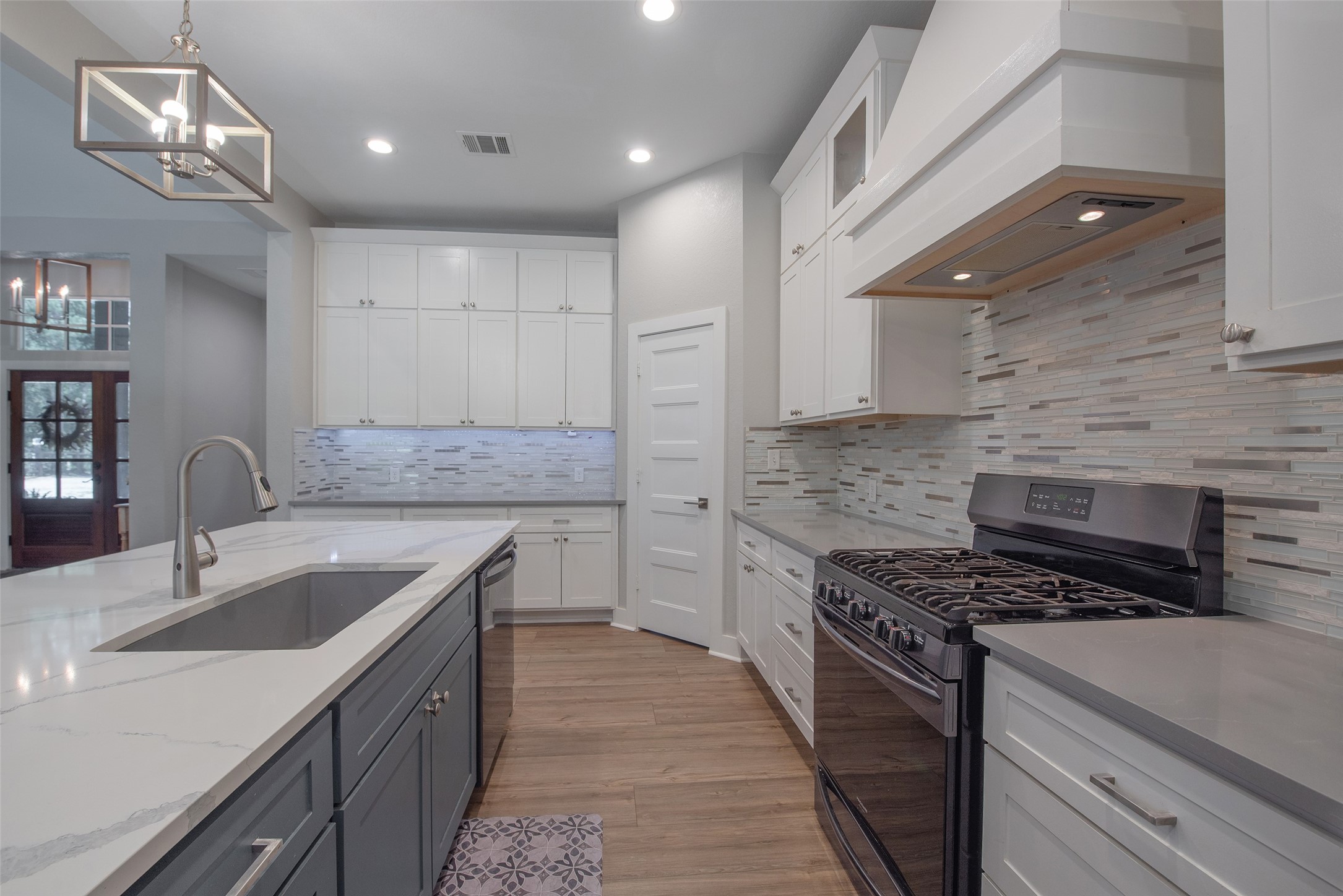 28406 Riley Road Waller, TX 77484 - Photo 7 of 31 Warning: Kitchens like this have been known to volunteer people for hosting Thanksgiving. Behind that door? The pantry that keeps the countertops looking this clean