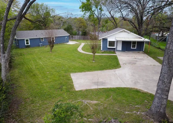 front view of a house with a yard