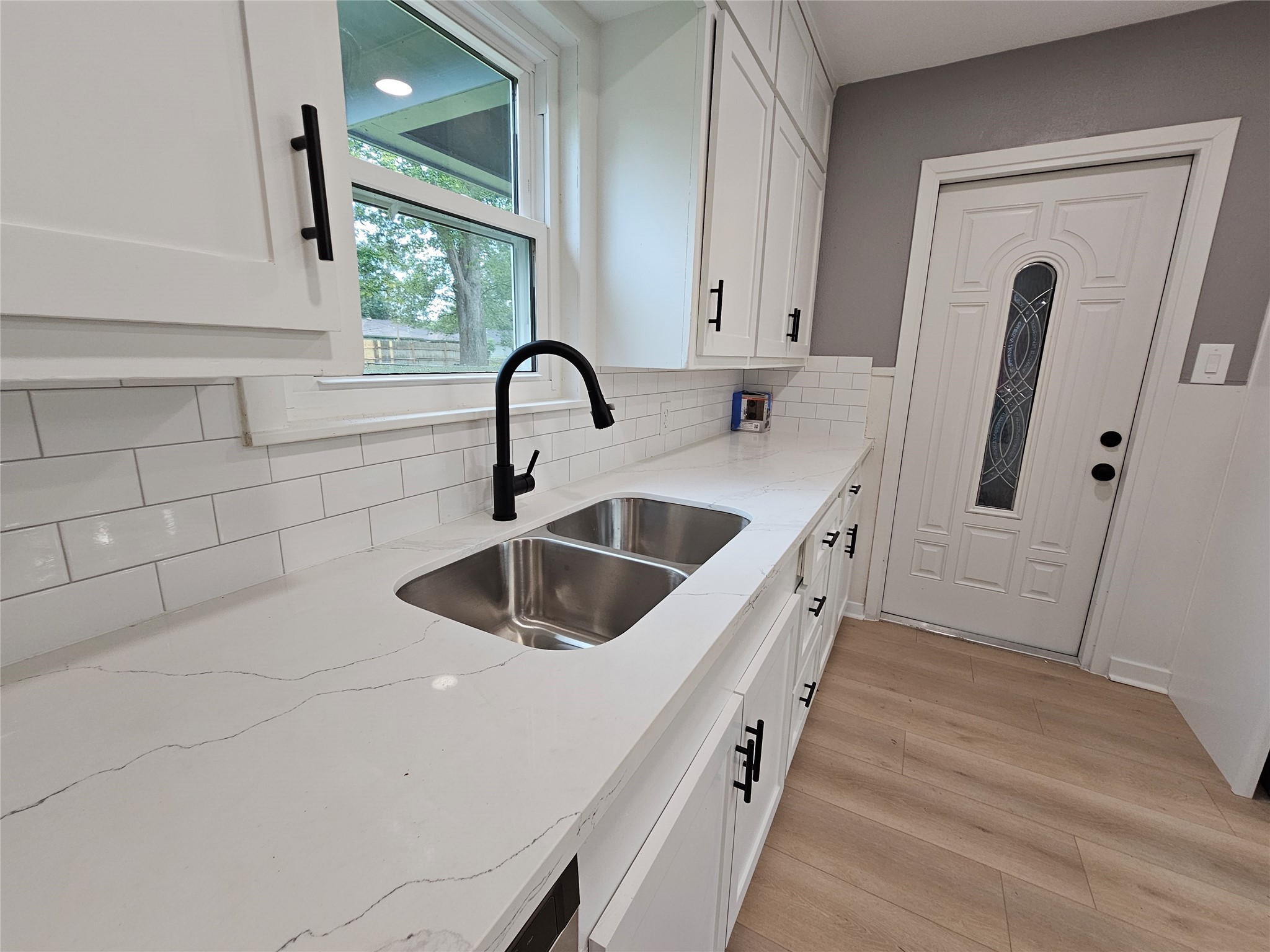 1300 Lawrence Street Rosenberg, TX 77471 - Photo 7 of 21 a kitchen with white cabinets and sink