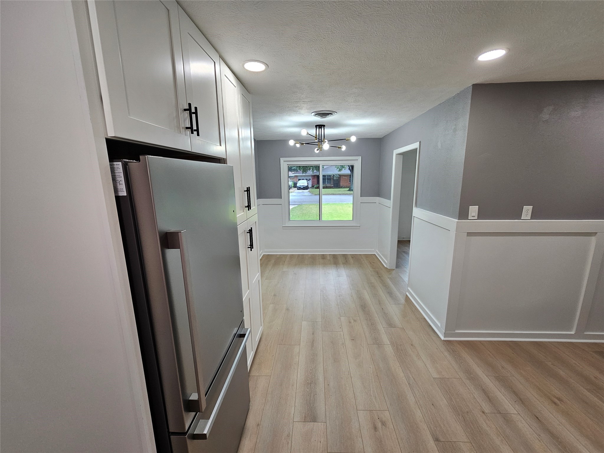 1300 Lawrence Street Rosenberg, TX 77471 - Photo 8 of 21 a view of hallway with wooden floor