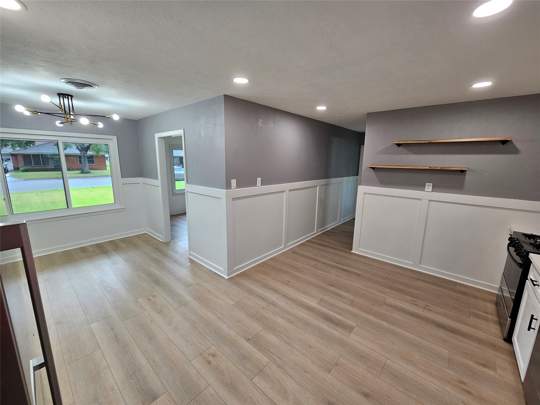 1300 Lawrence Street Rosenberg, TX 77471 - Photo 9 of 21 a view of a kitchen with a sink and a refrigerator