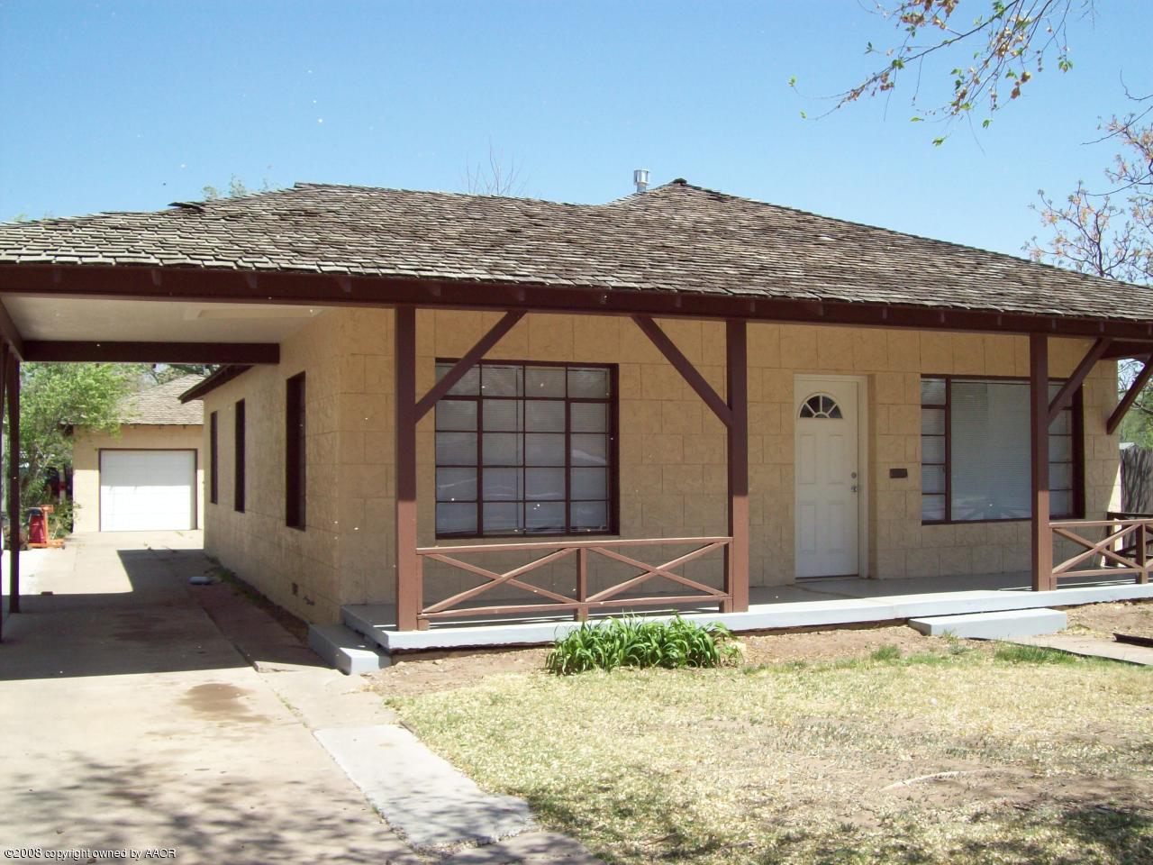 3711 South Polk Street Amarillo, TX 79110 - Photo 3 of 20 a view of a house with a small yard