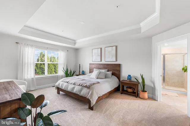 a bedroom with a bed and a couch