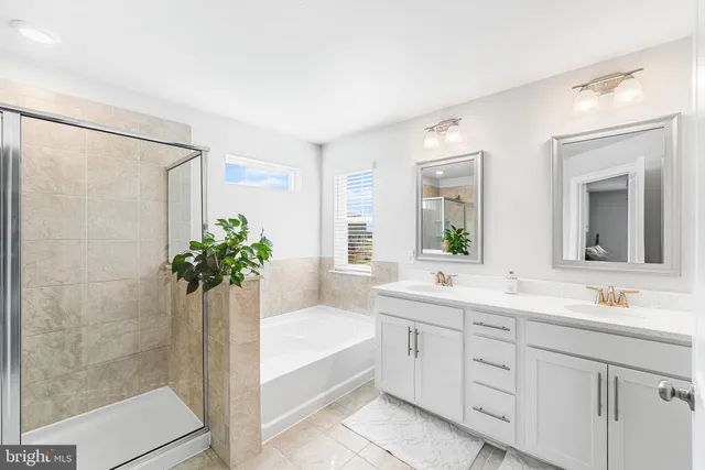 a bath room with a sink and a mirror