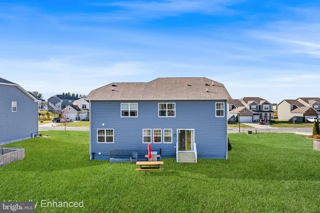 a aerial view of a house with a yard