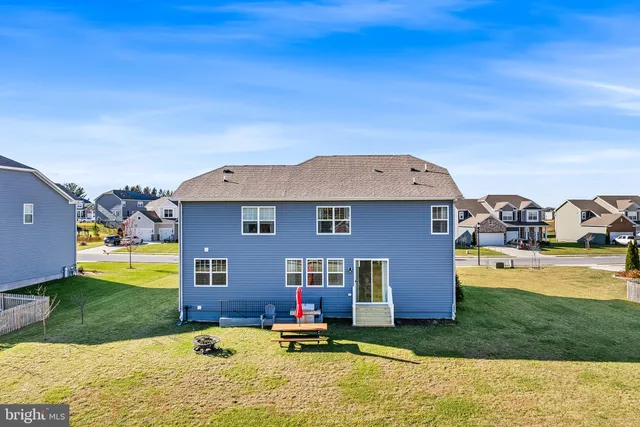a aerial view of a house with swimming pool