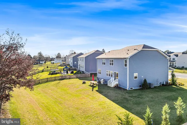 a view of a swimming pool with a yard