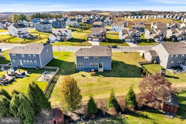 an aerial view of residential houses with outdoor space