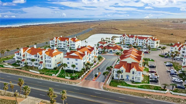 a view of a building with a windows and small yard