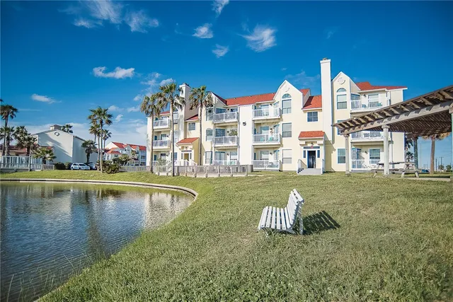 a view of a lake with a palm tree