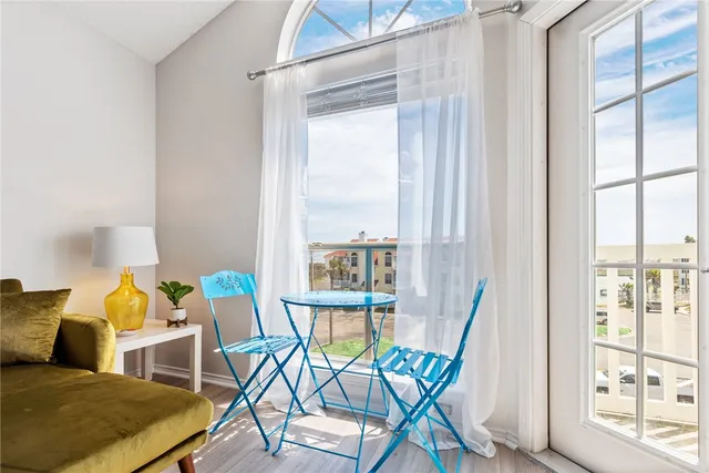 a view of a balcony with a floor to ceiling window