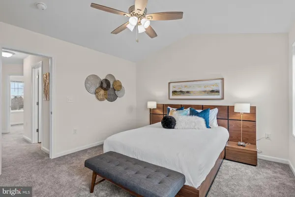 a bedroom with a bed and a table