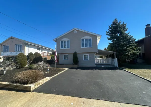 a front view of a house with yard