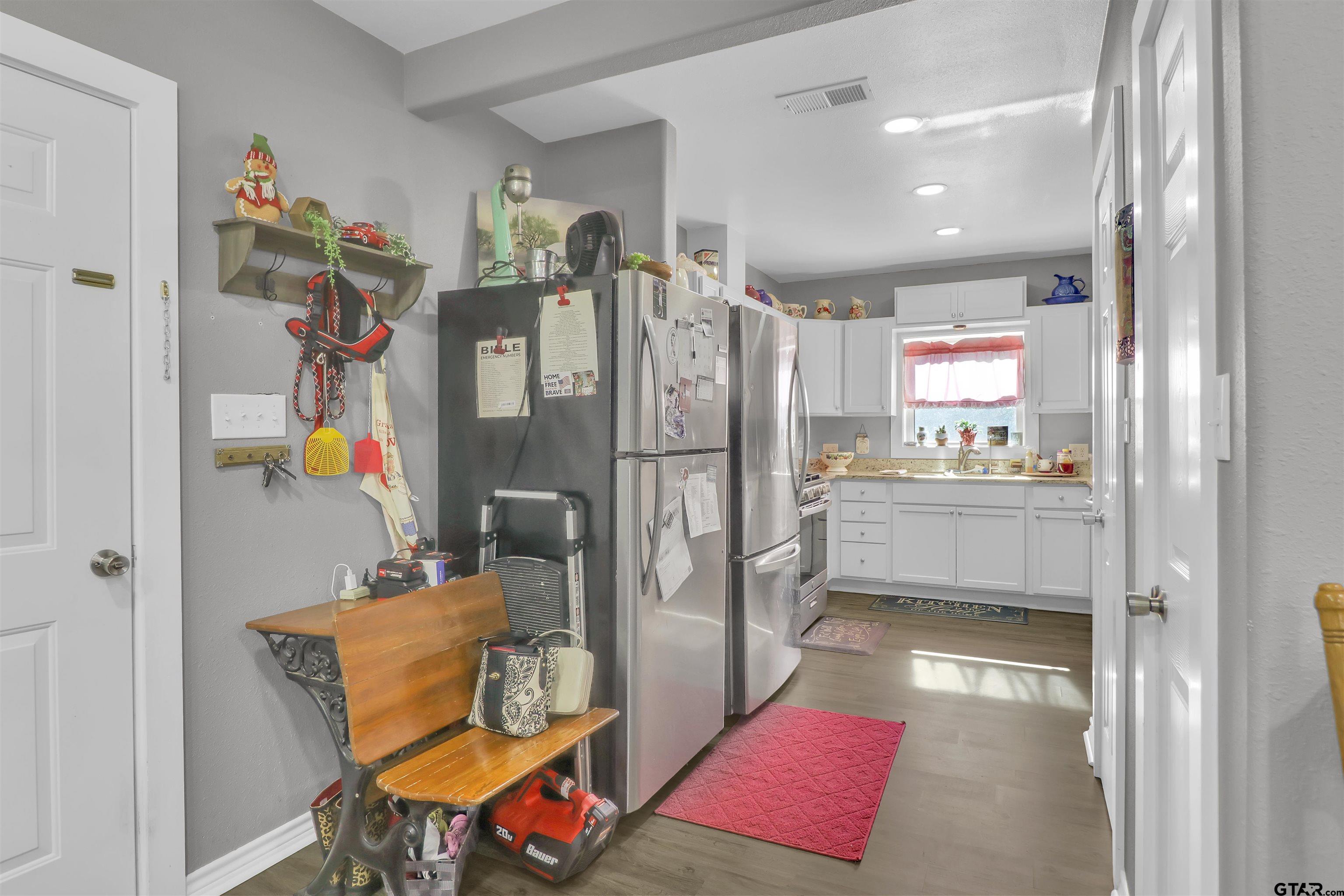 554 East San Antonio Street Alto, TX 75925 - Photo 10 of 28 a very nice looking open kitchen with stainless steel appliances granite countertop a refrigerator and a sink