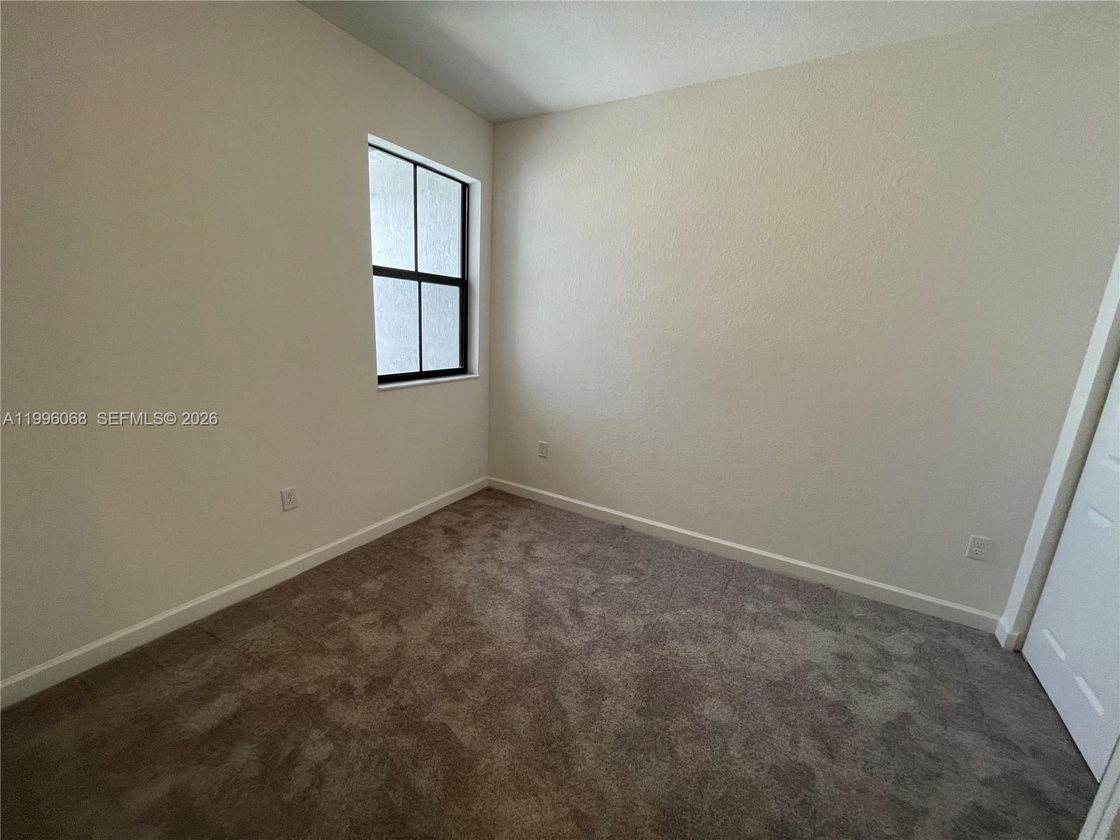 13262 Southwest 287th Terrace Homestead, FL 33033 - Photo 13 of 33 an empty room with windows