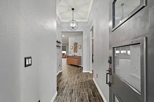 a view of a hallway view with wooden floor and staircase